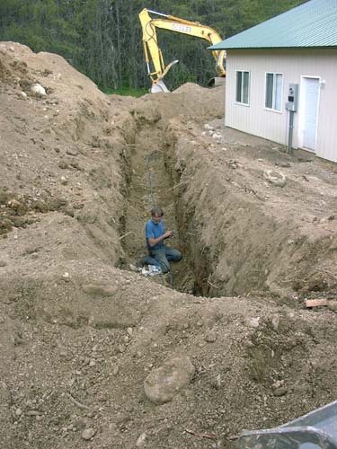 0043 - Greg fixing a cut phone line