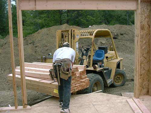 0056 - load of wood coming in master bay window