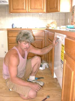 0218 - Eric installing the dishwasher